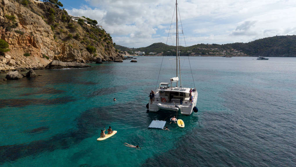 Salty Breeze swimmers in blue cove